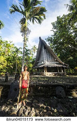 "Traditionally dressed boy standing in front of a traditional hut, Yap Island, Caroline Islands, Micronesia, Oceania" View Large Photo Image Stock Image - "Traditionally dressed boy standing in front of a traditional hut, Yap Island, Caroline Islands, Micronesia, Oceania". Fotosearch