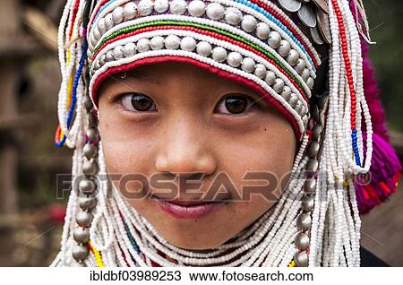 Stock Image - "Traditionally dressed girl from the Akha people, hill tribe, ethnic minority, portrait, Chiang Rai Province, Northern Thailand, Thailand, Asia". Fotosearch