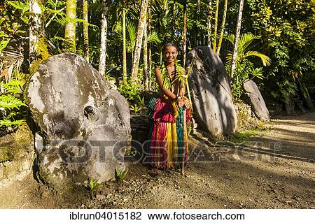 "Traditionally dressed girl standing in front of stone money, Yap Island, Caroline Islands, Micronesia, Oceania" View Large Photo Image Stock Image - "Traditionally dressed girl standing in front of stone money, Yap Island, Caroline Islands, Micronesia, Oceania". Fotosearch