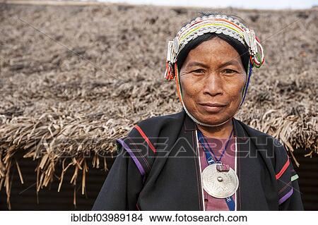 Picture - "Traditionally dressed woman from the Akha people, hill tribe, ethnic minority, portrait, Chiang Rai Province, Northern Thailand, Thailand, Asia". Fotosearch