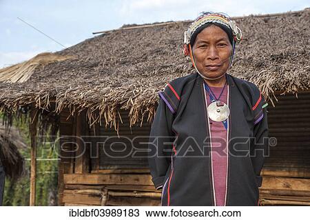 Stock Image - "Traditionally dressed woman from the Akha people, hill tribe, ethnic minority, portrait, Chiang Rai Province, Northern Thailand, Thailand, Asia". Fotosearch