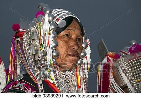 Stock Image - "Traditionally dressed woman from the Akha people, hill tribe, ethnic minority, portrait, Chiang Rai Province, Northern Thailand, Thailand, Asia". Fotosearch