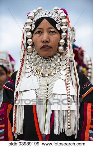 Stock Photo - "Traditionally dressed woman from the Akha people, hill tribe, ethnic minority, portrait, Chiang Rai Province, Northern Thailand, Thailand, Asia". Fotosearch