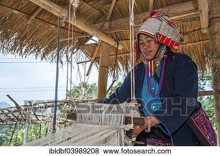 "Traditionally dressed woman from the Akha people, hill tribe, ethnic minority, working on a loom, Chiang Rai Province, Northern Thailand, Thailand, Asia" View Large Photo Image Stock Photo - "Traditionally dressed woman from the Akha people, hill tribe, ethnic minority, working on a loom, Chiang Rai Province, Northern Thailand, Thailand, Asia". Fotosearch