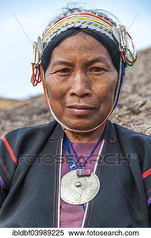 Stock Photography - "Traditionally dressed woman from the Akha people, hill tribe, ethnic minority, portrait, Chiang Rai Province, Northern Thailand, Thailand, Asia". Fotosearch