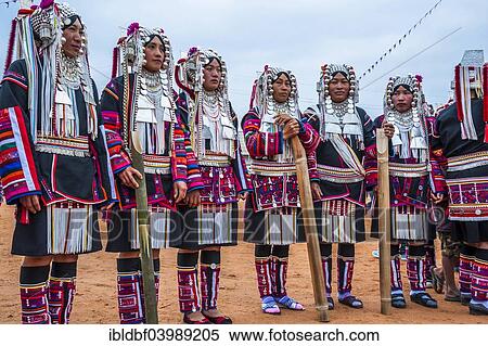 Stock Photography - "Traditionally dressed women from the Akha people, hill tribe, ethnic minority, dancing, New Year's celebrations, Chiang Rai Province, Northern Thailand, Thailand, Asia". Fotosearch