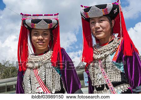 Stock Image - "Traditionally dressed young women from the Lisu people, ethnic minority, hill tribe, portrait, Mae Hong Son Province, Northern Thailand, Thailand, Asia". Fotosearch