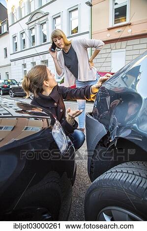 "Traffic accident, slight body damage to a car, crash while turning from an exit, woman involved in the accident using her cell phone to call for the police, Germany, Europe" View Large Photo Image Stock Image - "Traffic accident, slight body damage to a car, crash while turning from an exit, woman involved in the accident using her cell phone to call for the police, Germany, Europe". Fotosearch