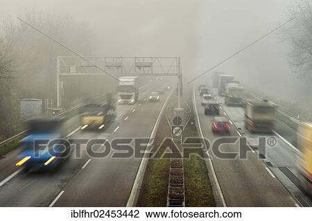 "Traffic flow on a highway in the fog, Grevenbroich, North Rhine-Westphalia, Germany, Europe" View Large Photo Image Stock Image - "Traffic flow on a highway in the fog, Grevenbroich, North Rhine-Westphalia, Germany, Europe". Fotosearch