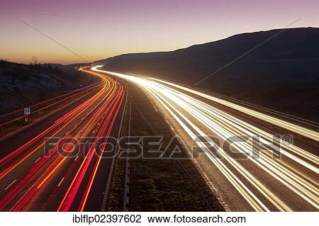 "Traffic light trails on motorway at dusk, M6 Motorway, Cumbria, England, United Kingdom, Europe" View Large Photo Image Stock Image - "Traffic light trails on motorway at dusk, M6 Motorway, Cumbria, England, United Kingdom, Europe". Fotosearch