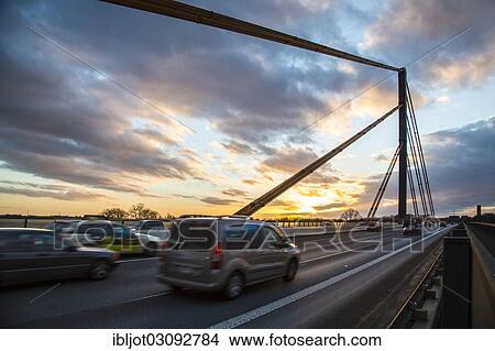 "Traffic on the bridge over the Rhine of the A40 motorway, Ruhrschnellweg, at sunset, Duisburg, North Rhine-Westphalia, Germany, Europe" View Large Photo Image Picture - "Traffic on the bridge over the Rhine of the A40 motorway, Ruhrschnellweg, at sunset, Duisburg, North Rhine-Westphalia, Germany, Europe". Fotosearch