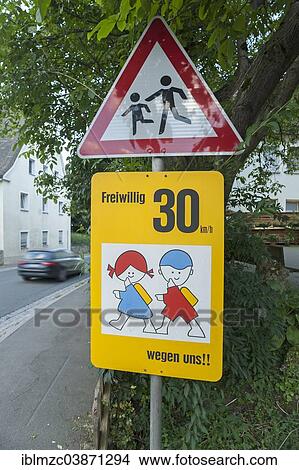 "Traffic sign """"caution children crossing"""", on a main road, Egloffstein, Bavaria, Germany, Europe" View Large Photo Image Picture - "Traffic sign """"caution children crossing"""", on a main road, Egloffstein, Bavaria, Germany, Europe". Fotosearch