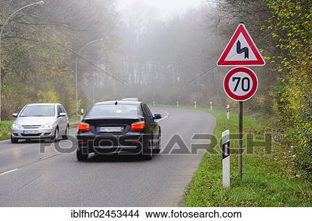 "Traffic signs before a curve, Grevenbroich, North Rhine-Westphalia, Germany, Europe" View Large Photo Image Picture - "Traffic signs before a curve, Grevenbroich, North Rhine-Westphalia, Germany, Europe". Fotosearch