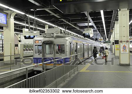 "Train from the Nankai Line at the station on a platform with a yellow guide strip for the visually impaired on the ground and video surveillance, Nambai Namba Railway Station in Osaka, Japan, East Asia, Asia" View Large Photo Image Stock Image - "Train from the Nankai Line at the station on a platform with a yellow guide strip for the visually impaired on the ground and video surveillance, Nambai Namba Railway Station in Osaka, Japan, East Asia, Asia". Fotosearch