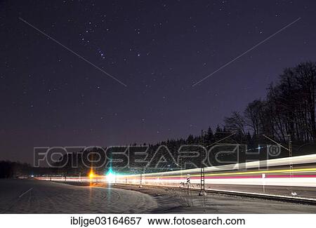 Stock Photo - "Train on a new moon night with a starry sky, Beimerstetten, Baden-Wurttemberg, Germany, Europe". Fotosearch