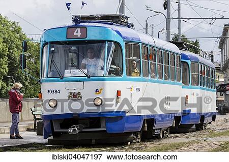 Stock Photo - "Tram at a stop, Riga, Latvia, Europe". Fotosearch