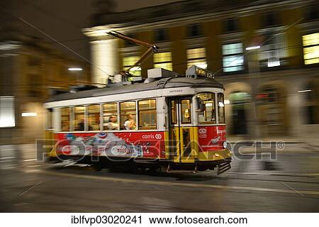 Stock Image - "Tram, Electrico, travelling on the Praca do Comercio, Lisbon, Portugal, Europe". Fotosearch