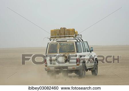 Stock Image - "Travel in an off-road vehicle in the Danakil Depression between Afdera and Ertale, Danakil-Senke, Afdera, Wollo, Ethiopia, Africa". Fotosearch