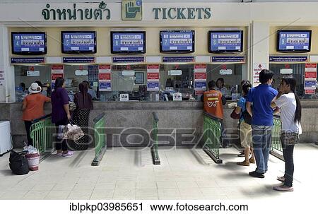 Stock Image - "Travellers at a counter of railway station, main station, Hua Lamphong, Bangkok, Thailand, Asia". Fotosearch