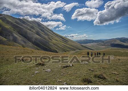 "Trekkers on Piano Grande plateau, Monti Sibillini National Park, Umbria, Italy, Europe" View Large Photo Image Picture - "Trekkers on Piano Grande plateau, Monti Sibillini National Park, Umbria, Italy, Europe". Fotosearch