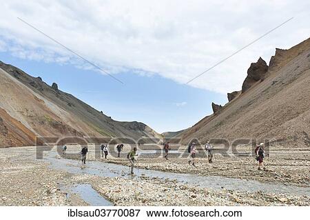 "Trekking, group of hikers crossing a creek bed, Stora Brandsgil torrential stream, Landmannalaugar, Rangarping ytra, Suourland, Iceland, Scandinavia, Europe" View Large Photo Image Stock Photo - "Trekking, group of hikers crossing a creek bed, Stora Brandsgil torrential stream, Landmannalaugar, Rangarping ytra, Suourland, Iceland, Scandinavia, Europe". Fotosearch
