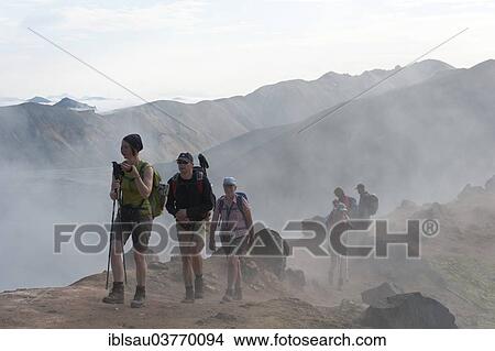 "Trekking in a mountain landscape, hiking group trekking through fog, solfataras steam, Brennisteinsalda, Landmannalaugar, Rangarping ytra, Suourland, Iceland, Scandinavia, Europe" View Large Photo Image Picture - "Trekking in a mountain landscape, hiking group trekking through fog, solfataras steam, Brennisteinsalda, Landmannalaugar, Rangarping ytra, Suourland, Iceland, Scandinavia, Europe". Fotosearch