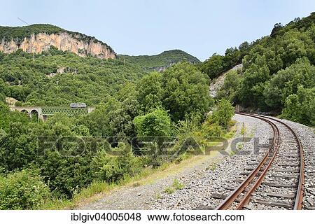 "Trenino Verde narrow gauge railway from Arbatax to Manda on a bridge near Niala, Ussassai, Ogliastra province, Sardinia, Italy, Europe" View Large Photo Image Stock Photo - "Trenino Verde narrow gauge railway from Arbatax to Manda on a bridge near Niala, Ussassai, Ogliastra province, Sardinia, Italy, Europe". Fotosearch