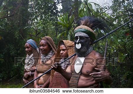 Stock Photograph - "Tribal chief and three women wearing traditional dresses, Highlands Region, Papua New Guinea, Oceania". Fotosearch