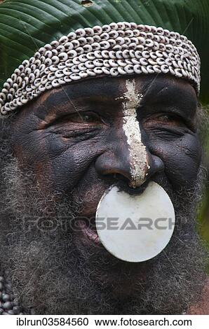 Stock Image - "Tribal chief wearing a traditional dress, Highlands Region, Papua New Guinea, Oceania". Fotosearch