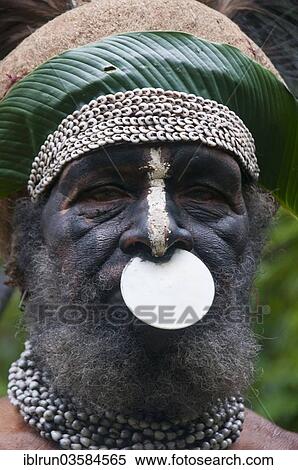 Stock Photography - "Tribal chief wearing a traditional dress, Highlands Region, Papua New Guinea, Oceania". Fotosearch