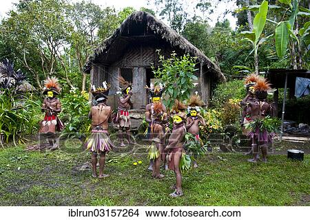 "Tribe with colourful decorations and face paint is celebrating at the traditional Sing Sing gathering in the highlands, Paya, Papua New Guinea, Oceania" View Large Photo Image Picture - "Tribe with colourful decorations and face paint is celebrating at the traditional Sing Sing gathering in the highlands, Paya, Papua New Guinea, Oceania". Fotosearch
