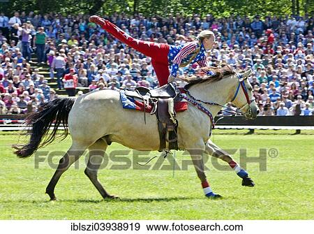 "Trick riding in an arena, Dulmen, Munsterland, North Rhine-Westphalia, Germany, Europe" View Large Photo Image Stock Photo - "Trick riding in an arena, Dulmen, Munsterland, North Rhine-Westphalia, Germany, Europe". Fotosearch