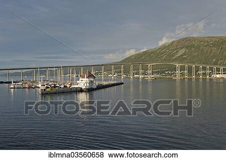 "Tromsosund with Tromsobrua or Tromso Bridge in evening light, Tromso, ‪Troms, Northern Norway, Norway, Europe" View Large Photo Image Stock Photo - "Tromsosund with Tromsobrua or Tromso Bridge in evening light, Tromso, ‪Troms, Northern Norway, Norway, Europe". Fotosearch