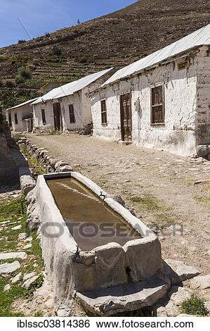"Trough and simple houses in Socoromo, Lauca National Park, Atacama Desert, northern Chile" View Large Photo Image Stock Photograph - "Trough and simple houses in Socoromo, Lauca National Park, Atacama Desert, northern Chile". Fotosearch