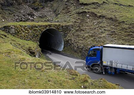 "Truck driving into a single-track tunnel between Husar and Mikladalur, Kalsoy, Faroe Islands, Denmark, Europe" View Large Photo Image Stock Image - "Truck driving into a single-track tunnel between Husar and Mikladalur, Kalsoy, Faroe Islands, Denmark, Europe". Fotosearch