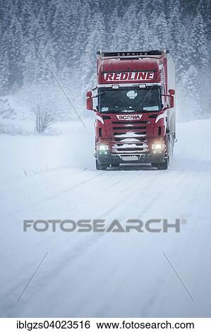 Stock Photograph - "Truck driving on snowy road, winter driving, Norway, Europe". Fotosearch