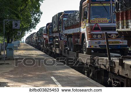 "Trucks transported on train, Gokarna, Karnataka, India, Asia" View Large Photo Image Stock Image - "Trucks transported on train, Gokarna, Karnataka, India, Asia". Fotosearch