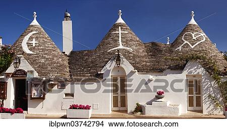 "Trulli houses, roofs with traditional symbols, Alberobello, Puglia, Italy, Europe" View Large Photo Image Picture - "Trulli houses, roofs with traditional symbols, Alberobello, Puglia, Italy, Europe". Fotosearch
