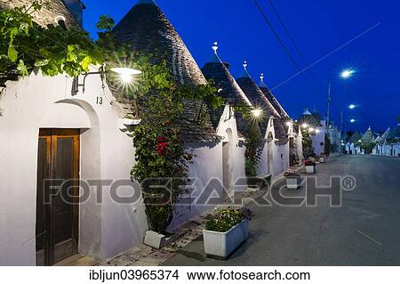 "Trulli, traditional round houses, trullo settlement, at dusk, blue hour, Rione Monti district of Alberobello, Valle d'Itria, Trulli Valley, Apulia, Italy, Europe" View Large Photo Image Picture - "Trulli, traditional round houses, trullo settlement, at dusk, blue hour, Rione Monti district of Alberobello, Valle d'Itria, Trulli Valley, Apulia, Italy, Europe". Fotosearch