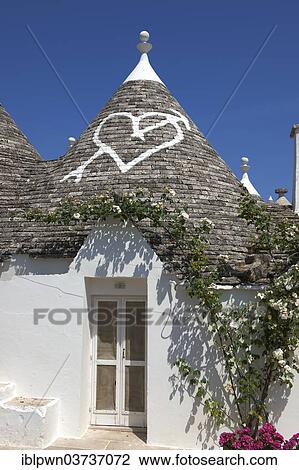 "Trullo house, roof with traditional symbol, Alberobello, Puglia, Italy, Europe" View Large Photo Image Stock Image - "Trullo house, roof with traditional symbol, Alberobello, Puglia, Italy, Europe". Fotosearch