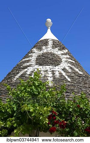 "Trullo house roof with traditional symbol, Alberobello, Puglia, Italy, Europe" View Large Photo Image Stock Image - "Trullo house roof with traditional symbol, Alberobello, Puglia, Italy, Europe". Fotosearch
