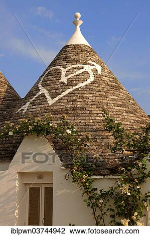 "Trullo house, roof with traditional symbol, Alberobello, Puglia, Italy, Europe" View Large Photo Image Stock Image - "Trullo house, roof with traditional symbol, Alberobello, Puglia, Italy, Europe". Fotosearch