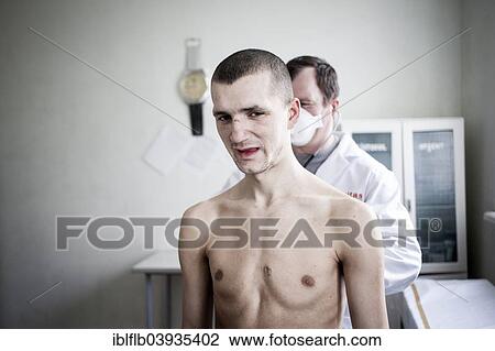 Stock Image - "Tuberculosis and HIV in Moldova, examination on the TB ward in the prison of ChiÈ™inau, Moldova, Europe". Fotosearch