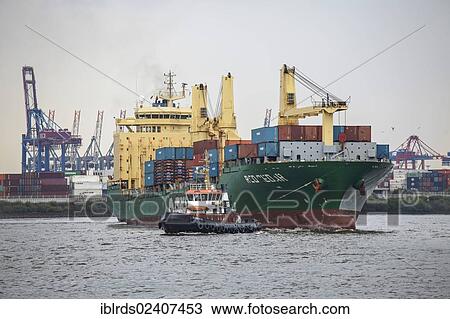 "Tug boat towing a container ship on the Elbe, Hamburg, Germany, Europe" View Large Photo Image Stock Image - "Tug boat towing a container ship on the Elbe, Hamburg, Germany, Europe". Fotosearch