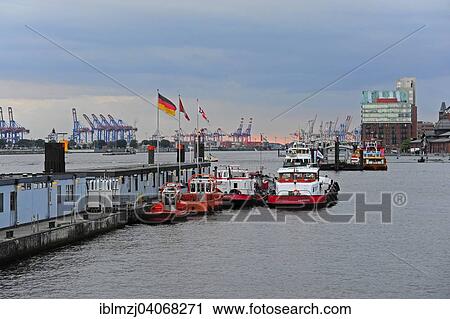 "Tug boats at St. Pauli, Hamburg harbor on the Elbe, Hamburg, Germany, Europe" View Large Photo Image Stock Image - "Tug boats at St. Pauli, Hamburg harbor on the Elbe, Hamburg, Germany, Europe". Fotosearch