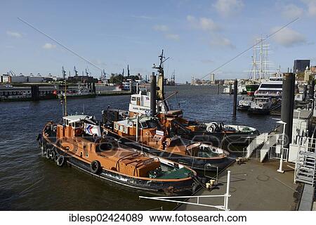 Stock Photo - Tugboats in the port, St. Pauli landing bridges, Hanseatic City of Hamburg, Germany, Europe. Fotosearch