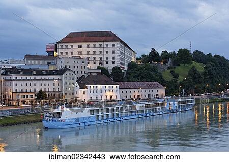 Stock Image - "TUI Maxima, a cruise ship floating on the Danube river, Linz Castle at the back, Linz, Upper Austria, Austria, Europe, PublicGround, Europe". Fotosearch
