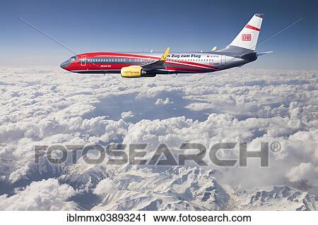 "TUIfly Boeing 737-8K5 WL with inscription """"Rail & Fly"""", with the train to the airport, in flight over mountains, Turkey, Asia" View Large Photo Image Stock Image - "TUIfly Boeing 737-8K5 WL with inscription """"Rail & Fly"""", with the train to the airport, in flight over mountains, Turkey, Asia". Fotosearch