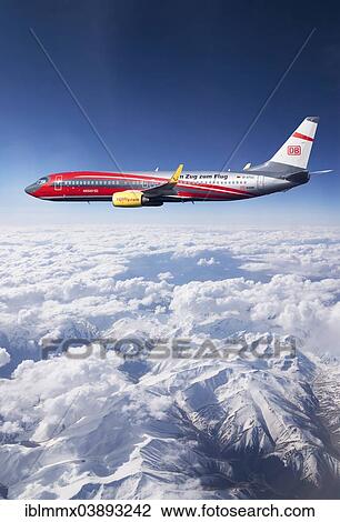 "TUIfly Boeing 737-8K5 WL, with the slogan """"Im Zug zum Flug"""", German for """"take the train to the plane"""", rail and fly, in flight over mountains, Turkey, Asia" View Large Photo Image Stock Image - "TUIfly Boeing 737-8K5 WL, with the slogan """"Im Zug zum Flug"""", German for """"take the train to the plane"""", rail and fly, in flight over mountains, Turkey, Asia". Fotosearch