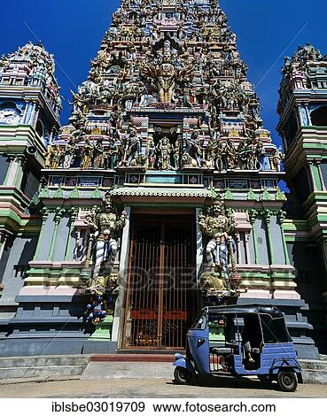 "Tuk tuk in front of the gopuram or gate tower at the entrance to the Hindu temple of Colombo II, Fort District, Colombo, Westprovinz, Sri Lanka, Asia" View Large Photo Image Stock Photo - "Tuk tuk in front of the gopuram or gate tower at the entrance to the Hindu temple of Colombo II, Fort District, Colombo, Westprovinz, Sri Lanka, Asia". Fotosearch